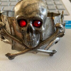 A Custom Made Skull & Crossbones Cuff Bracelet with red crystal eyes.